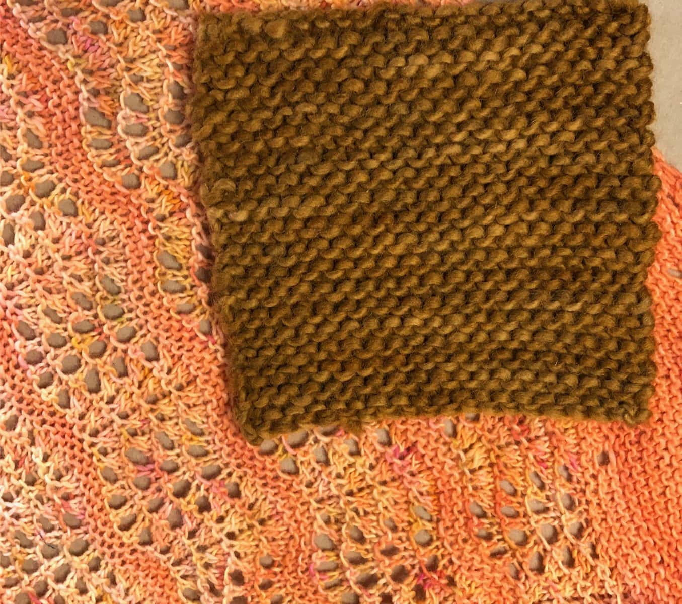 image description: a close-up view of a swatch of garter stitch fabric; wear and pilling are evident on the surface