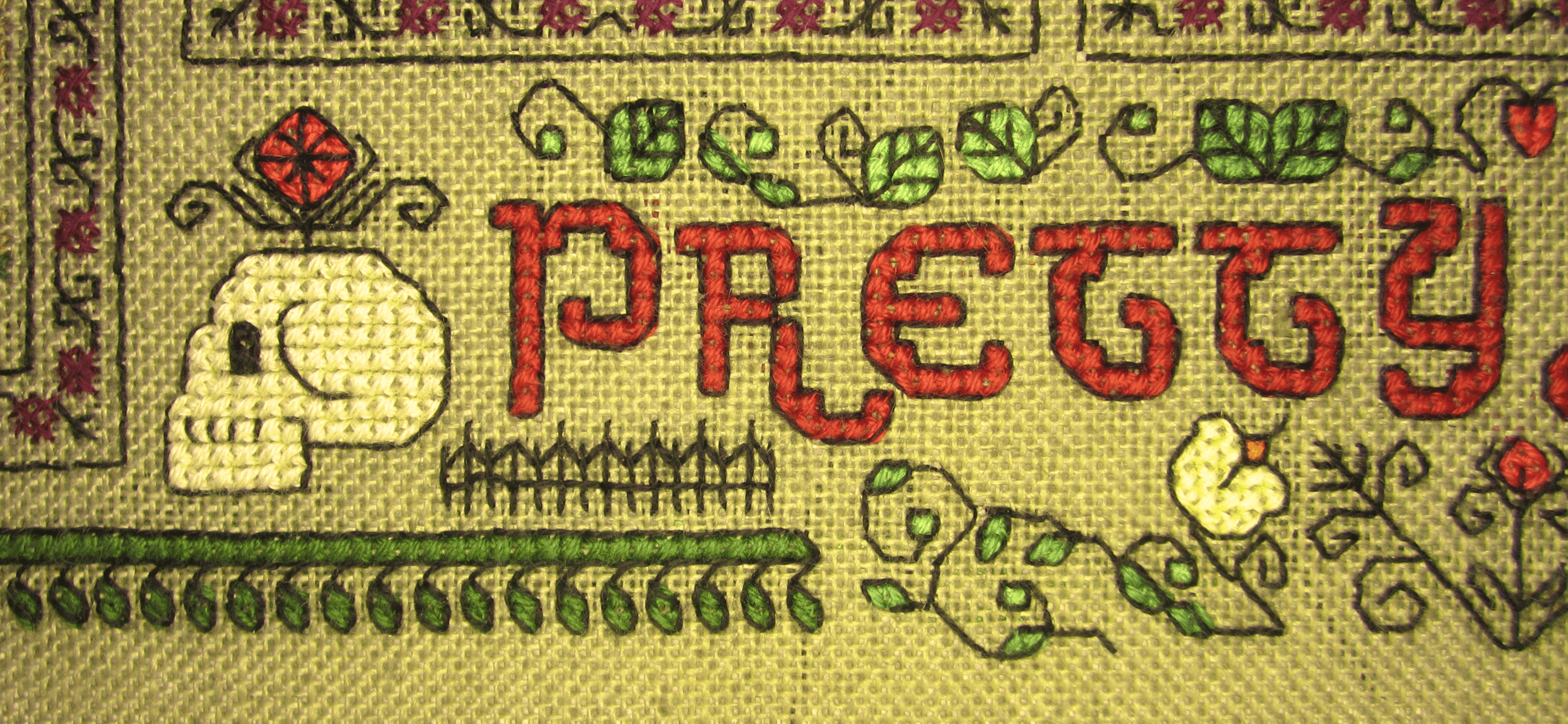 image description: a close-up of a small portion of the border of a cross-stitch project